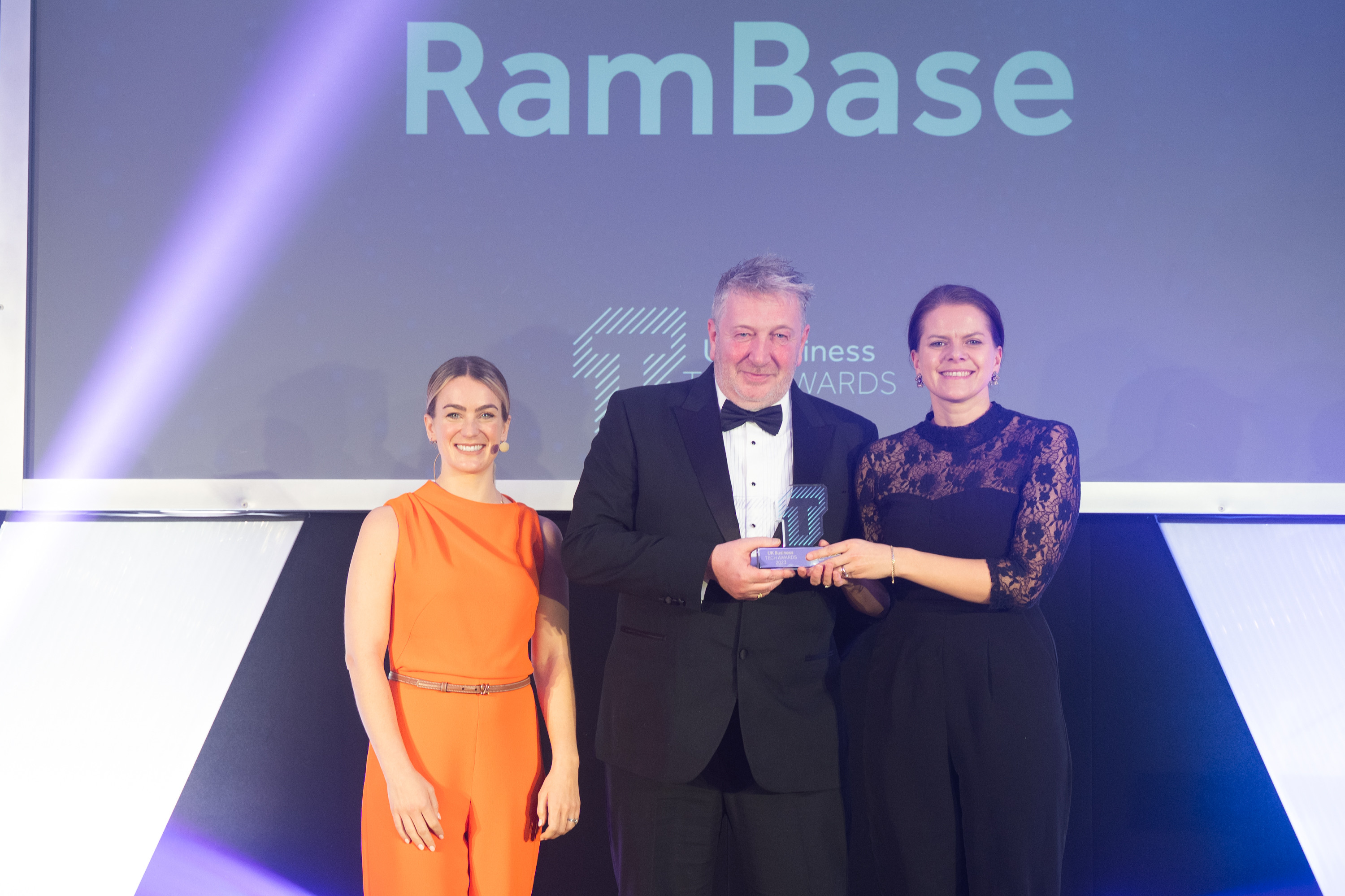 Pictured: Awards presenter Georgie Barrat, RamBase UK Channel Manager, Peter Fehily and RamBase Content Manager, Elisabeth. M. Aardal.
